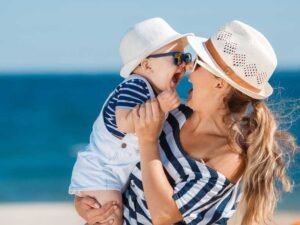 happy-mother-with-little-boy-having-fun-beach-near-sea.jpg